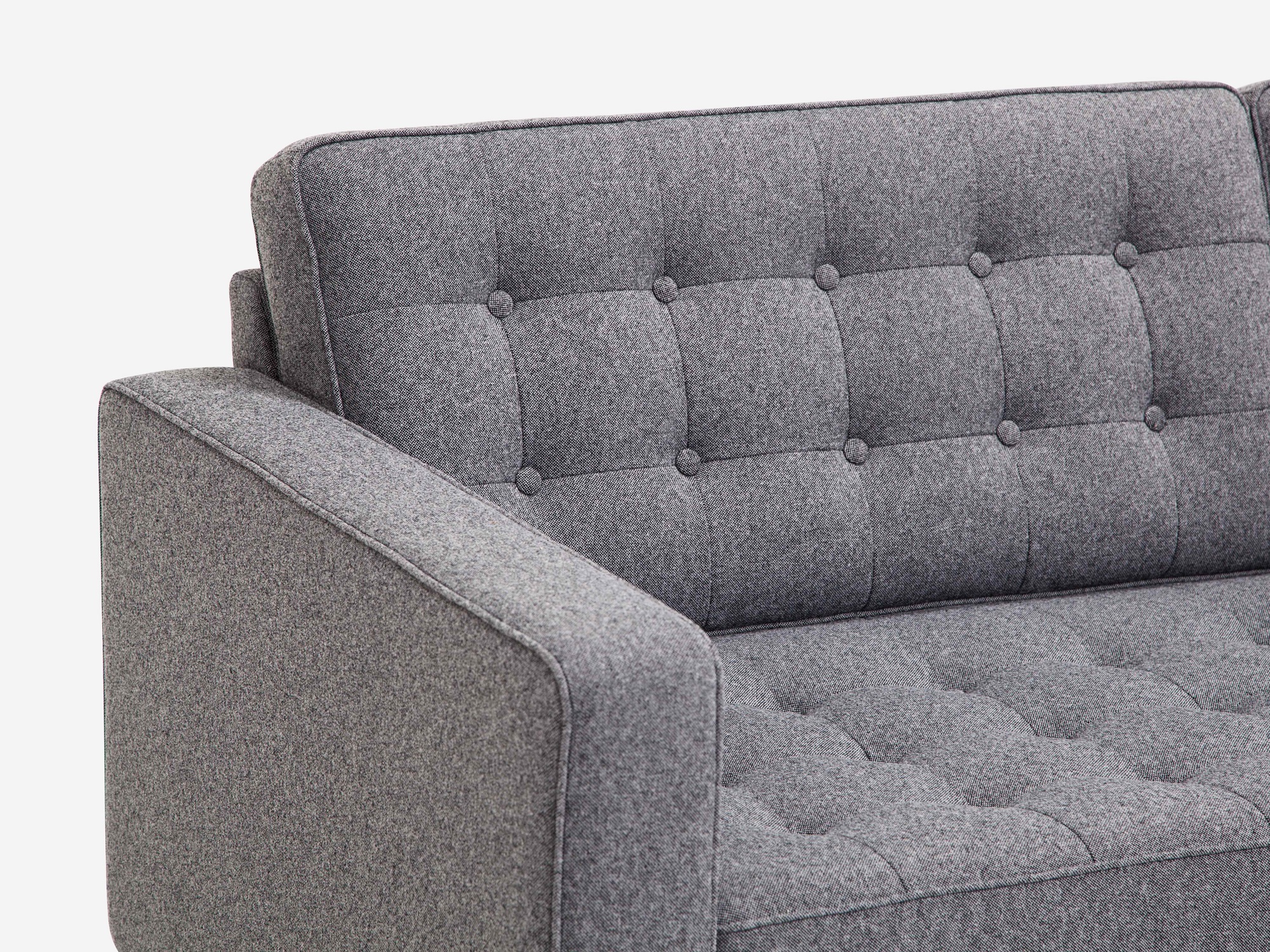 Detail left arm view of our mid century modern sofa, the Reverie 92", upholstered in grey fabric